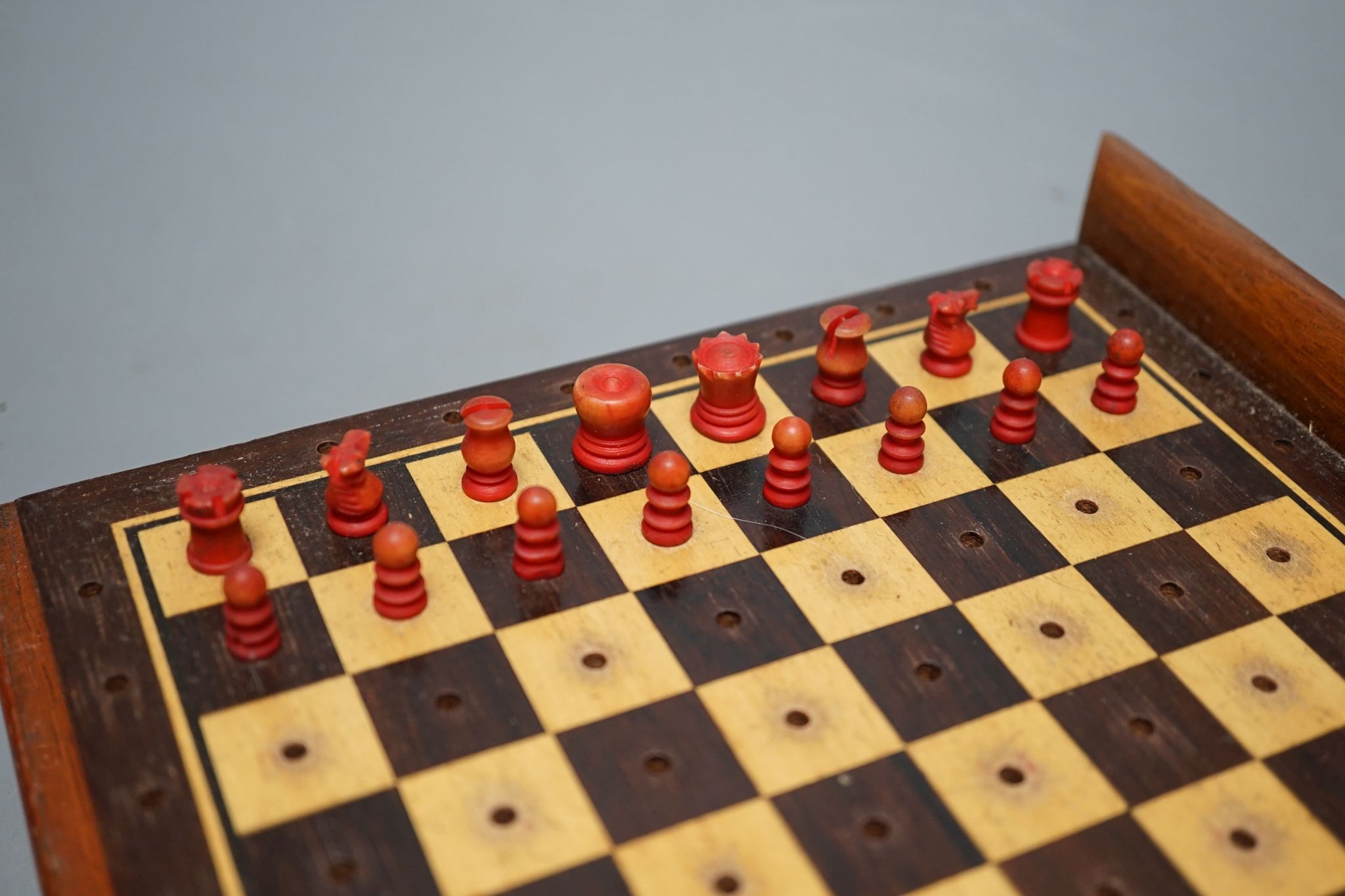 Two boxed chess sets, one turned wood, the other bone
